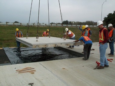 photo - construction crew installing a prefabricated bridge element
