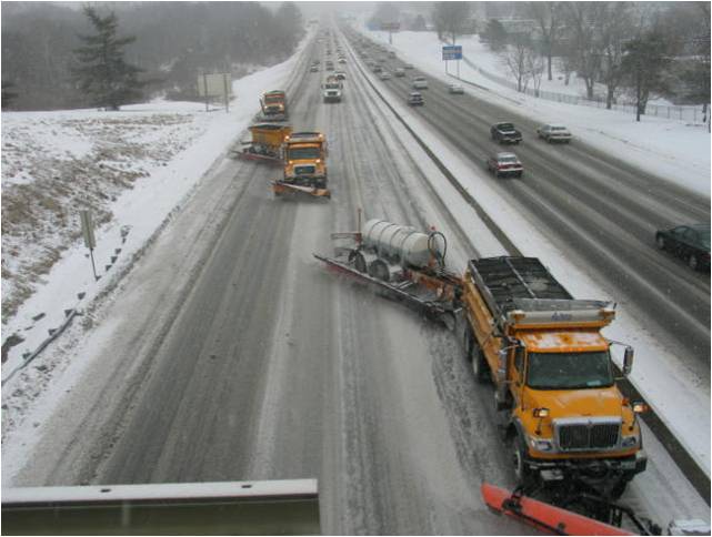 towplow in use along busy highway